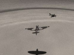 A Spitfire strafing the enemy at the captured airbase