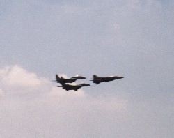 Two MiG-29s and a MiG-23 in formation